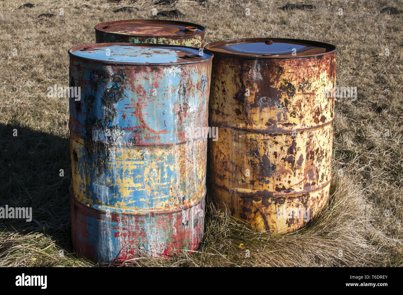 Old rusty abandoned fuel barrel drums Stock Photo Alamy