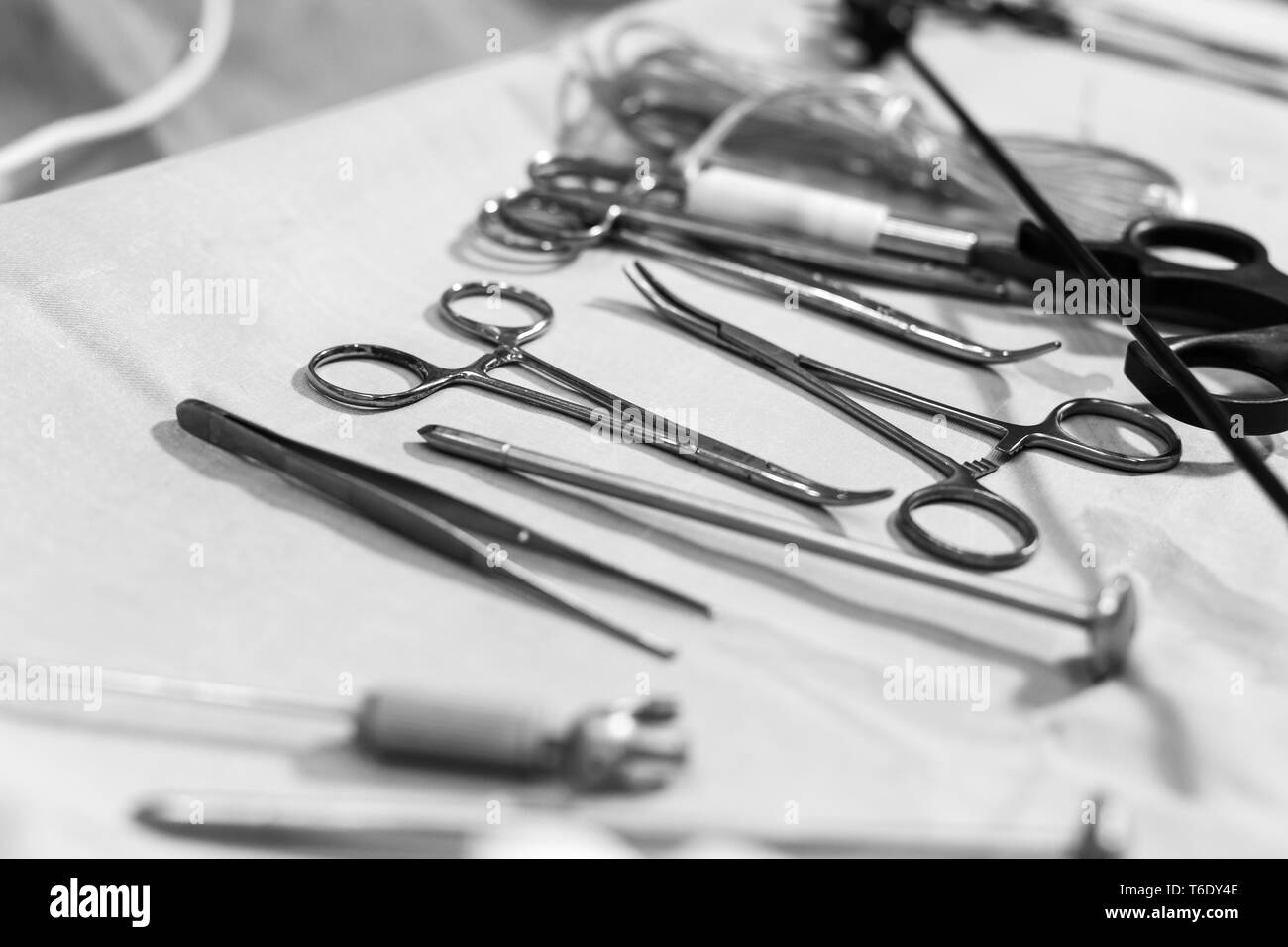 metal surgical clamps on white sterile table. Stock Photo