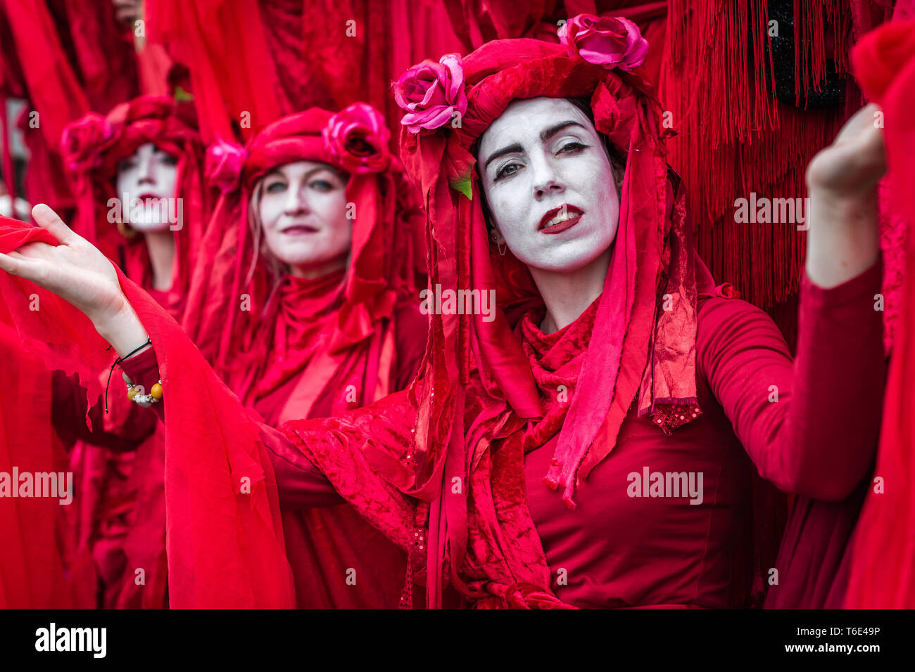 The Red Brigade of Extinction Rebellion on Waterloo Bridge. Stock Photo