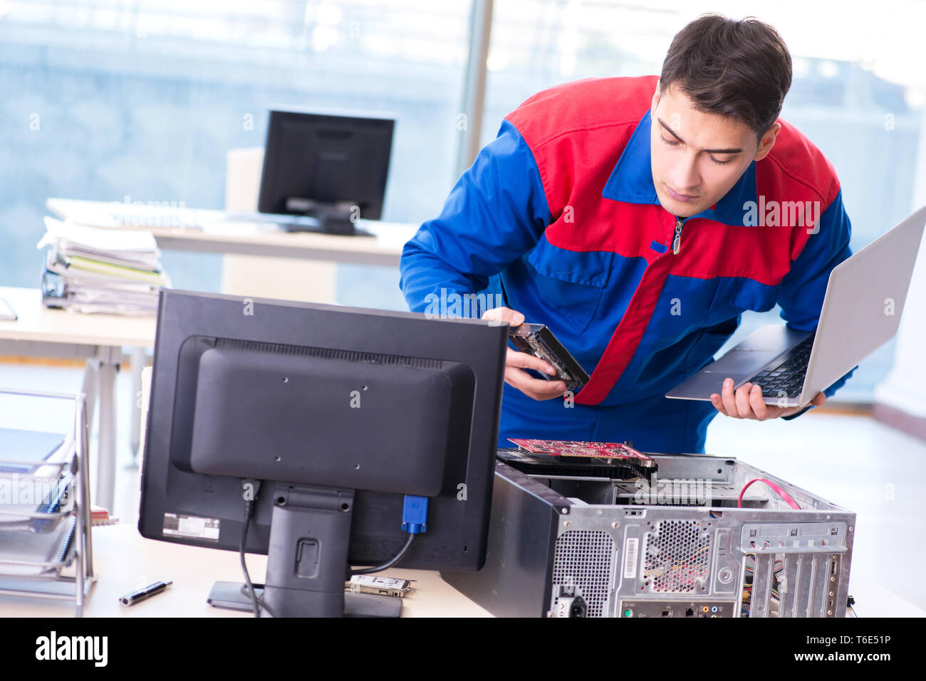 Computer repairman specialist repairing computer desktop Stock Photo ...