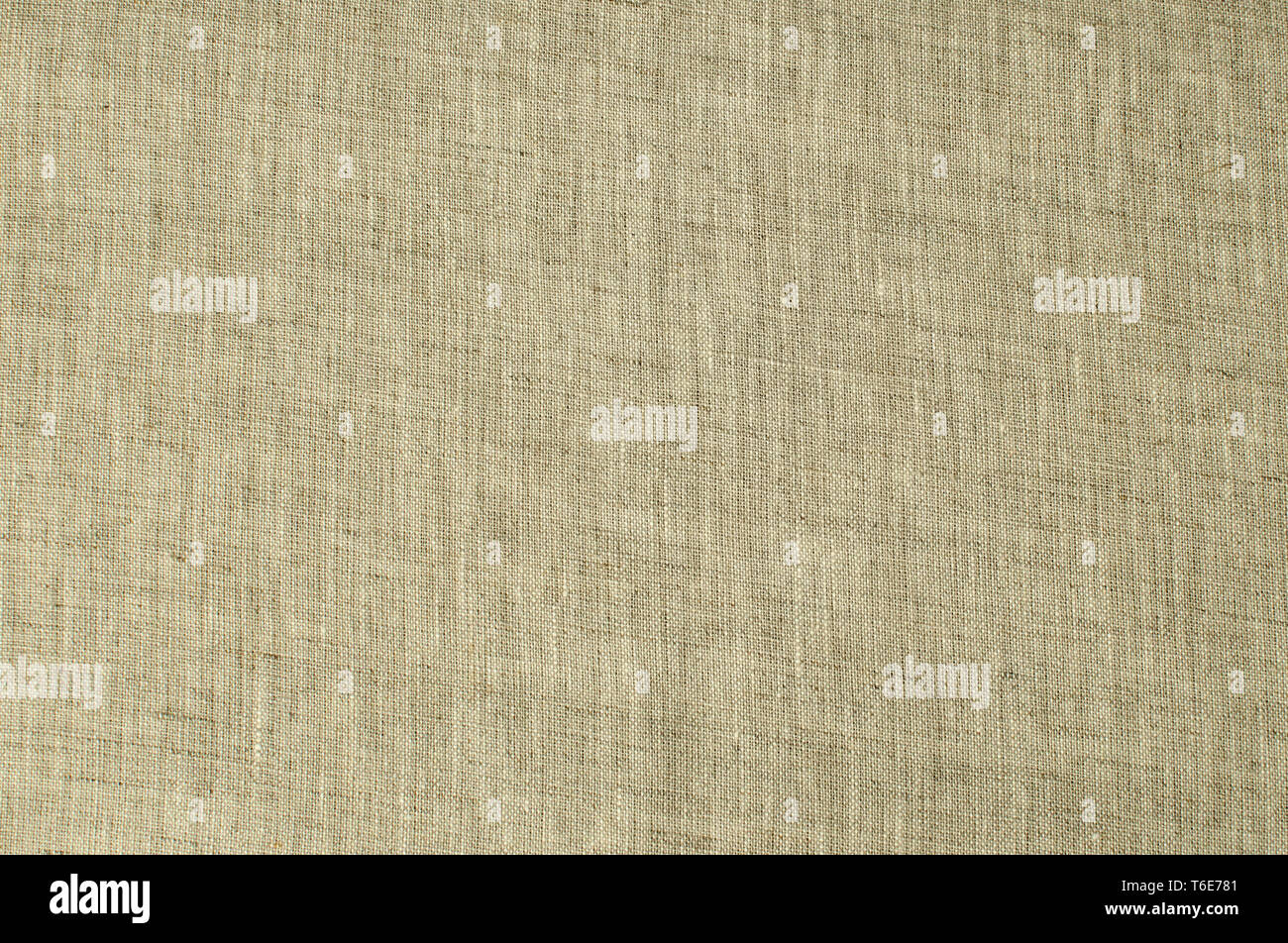 Texture of natural linen flax fabric closeup as textile background