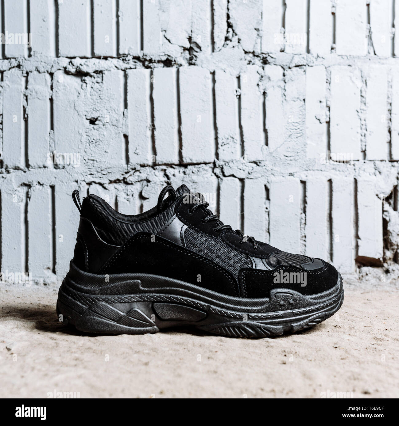Black sneakers with white soles hi-res stock photography and images - Alamy