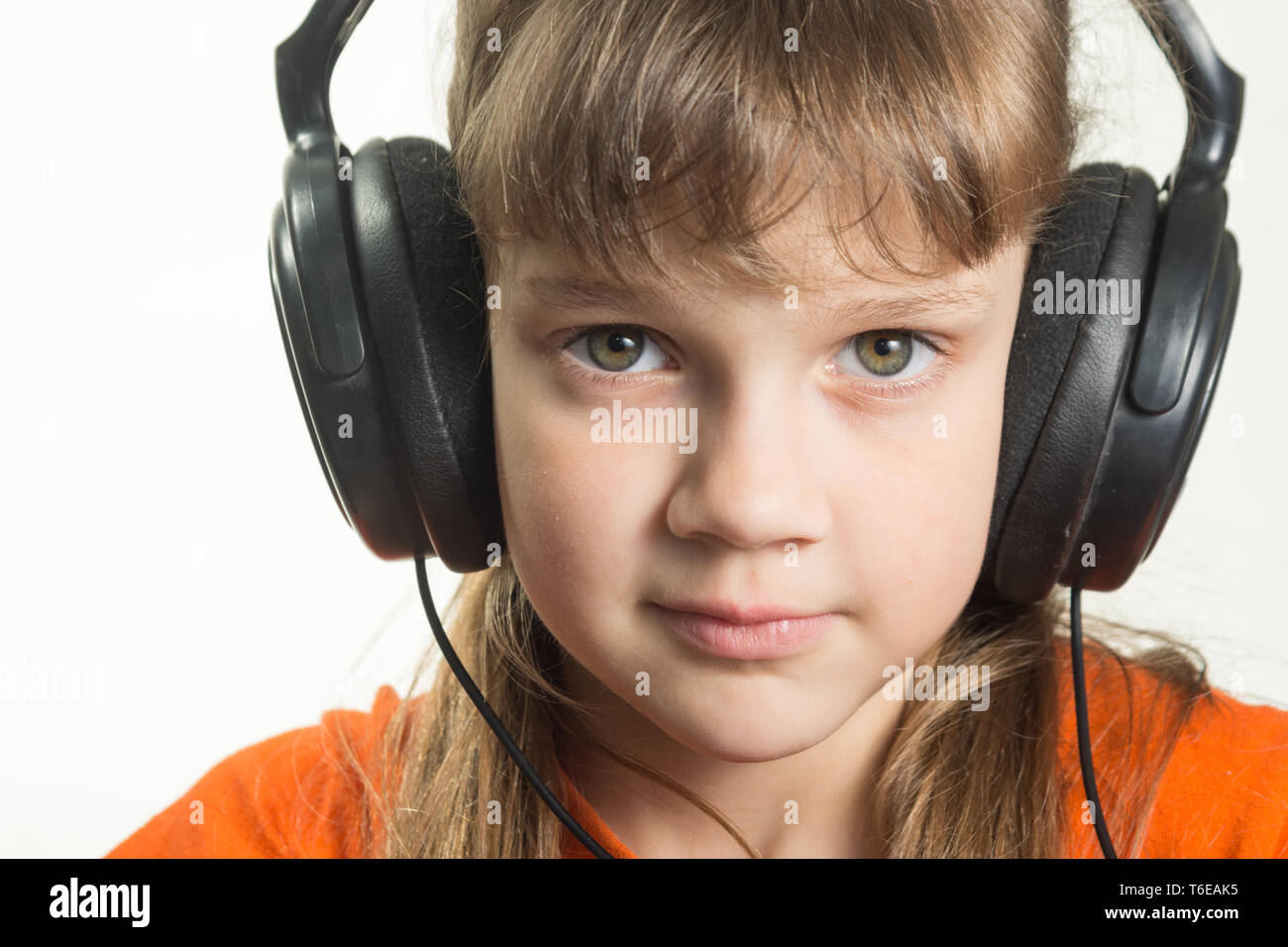 Portrait of a purposeful girl with headphones Stock Photo
