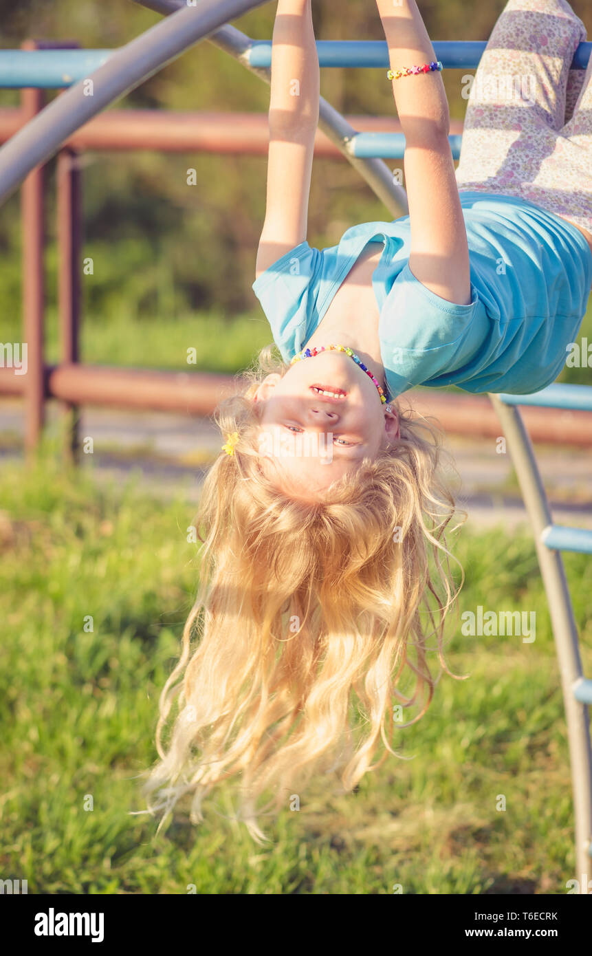 adorable blond girl up side down Stock Photo - Alamy