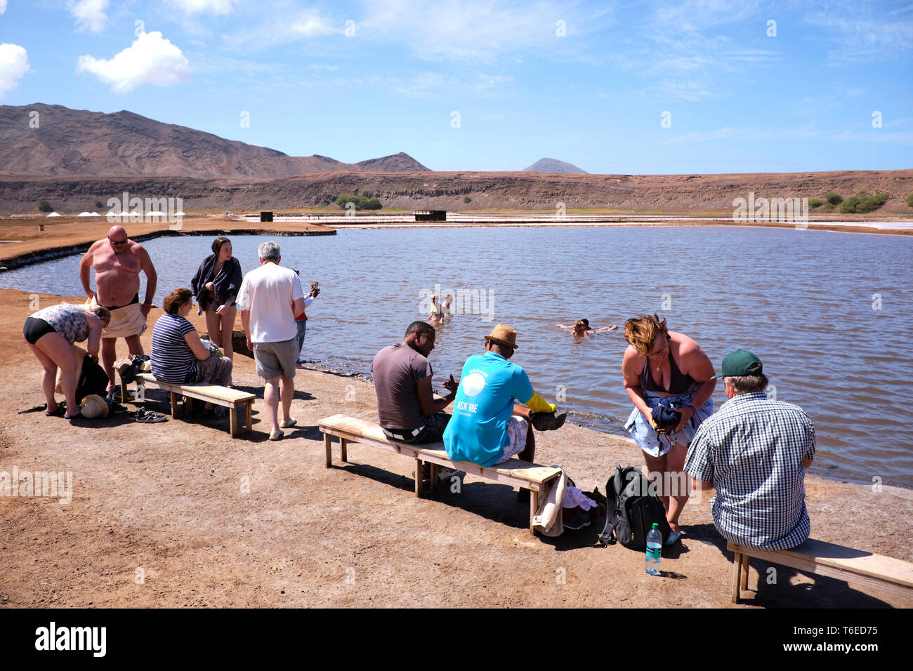 Tourists Floating On A Pool At The Salt Flats, Pedra Lume Salt Crater, Sal Island, Cape Verde, Africa Stock Photo