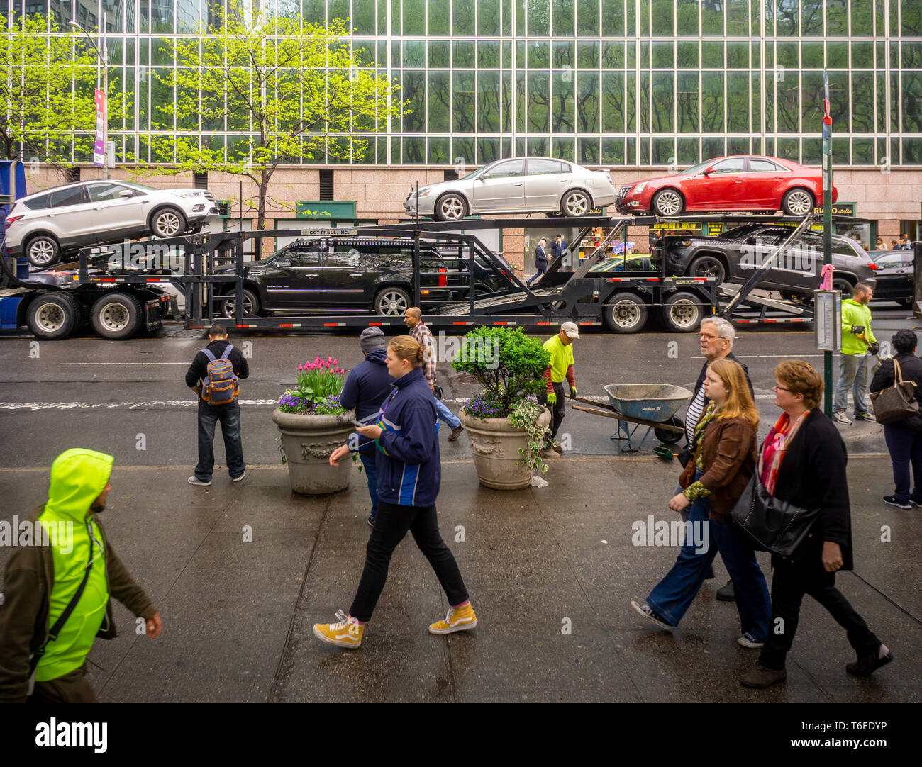 An automobile transport loaded with multiple brands of cars travels through Midtown Manhattan on Friday, April 26, 2019. (© Richard B. Levine) Stock Photo