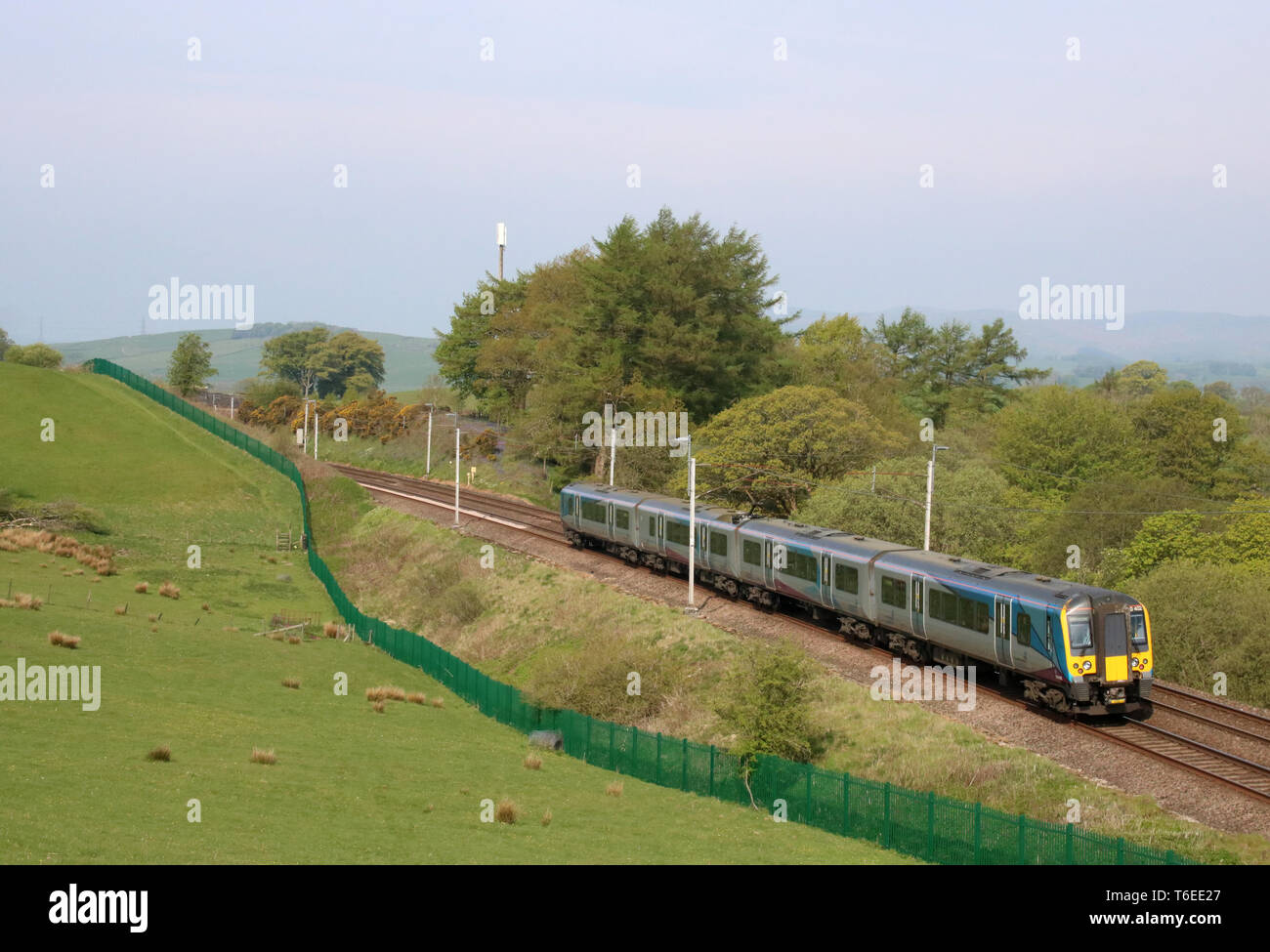 Class 350 Siemens Desiro emu train 350 402 operated by TransPennine Express passing Grayrigg in Cumbria on the West Coast Mainline on 30th April 2019. Stock Photo