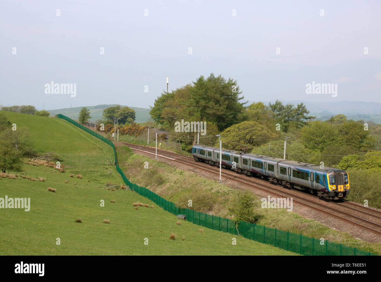 Class 350 Siemens Desiro emu train 350 405 operated by TransPennine Express passing Grayrigg in Cumbria on the West Coast Mainline on 30th April 2019. Stock Photo