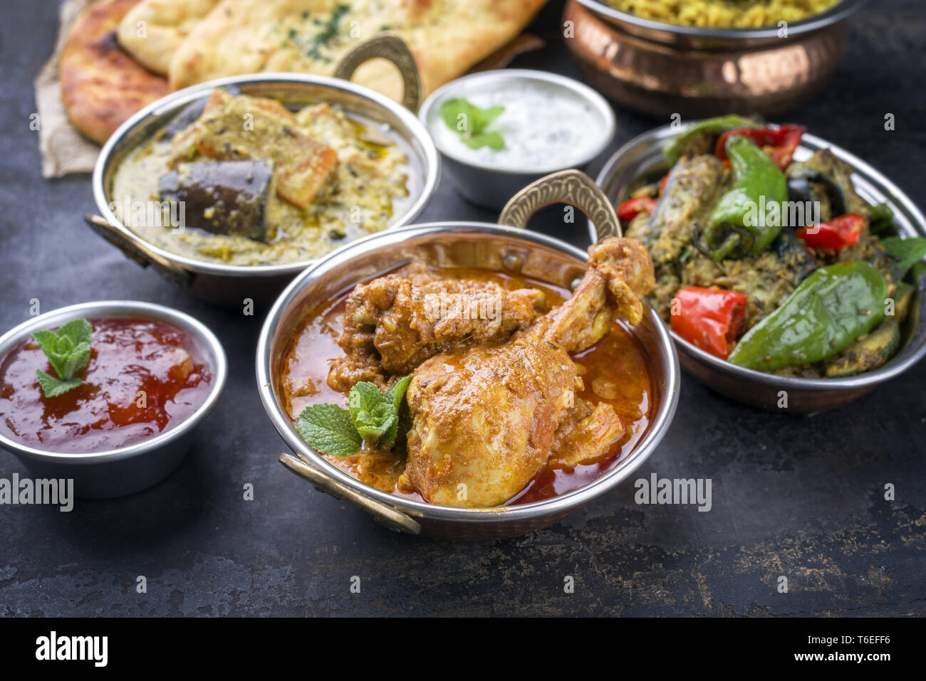 Traditional Indian Curries and Biryani with Mango Chutney and Pita