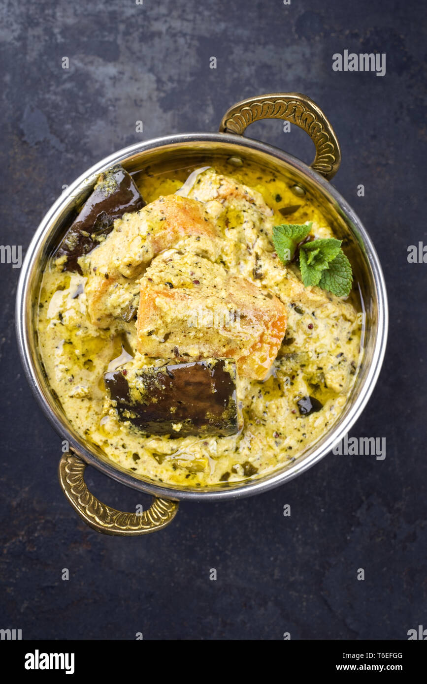 Traditional Indian Vegetable Curry with Sweet Potatoes and Eggplant as closeup in a Korai Stock