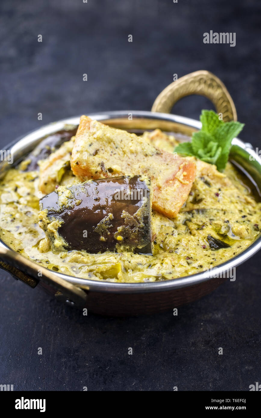 Traditional Indian Vegetable Curry with Sweet Potatoes and Eggplant as closeup in a Korai Stock