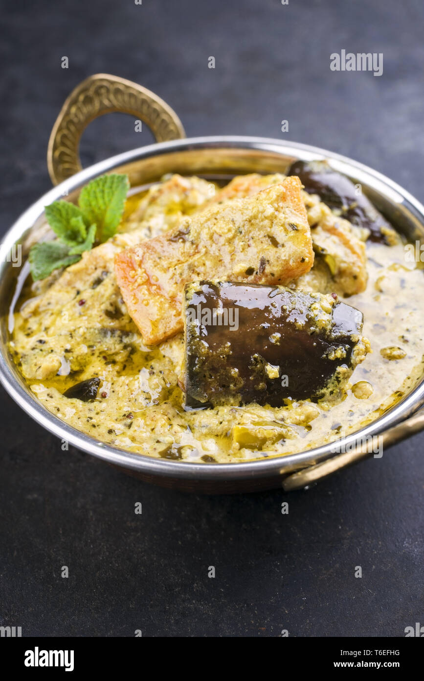 Traditional Indian Vegetable Curry with Sweet Potatoes and Eggplant as closeup in a Korai Stock