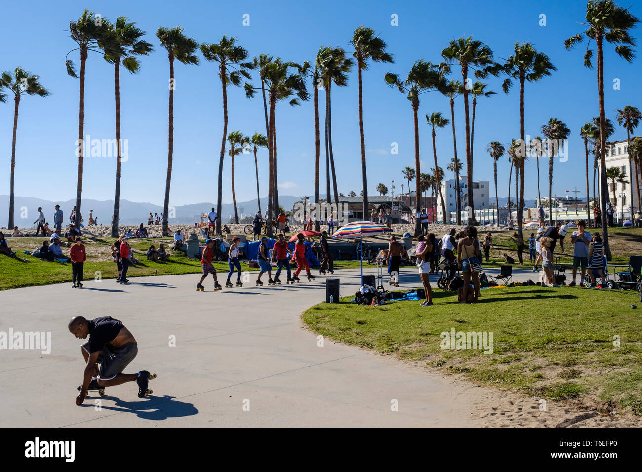 Roller skate dancers enjoying a great sunny day in Venice Beach, Los