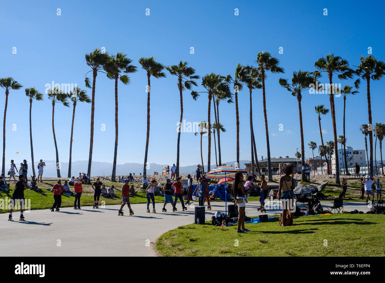 Roller skate dancers enjoying a great sunny day in Venice Beach, Los