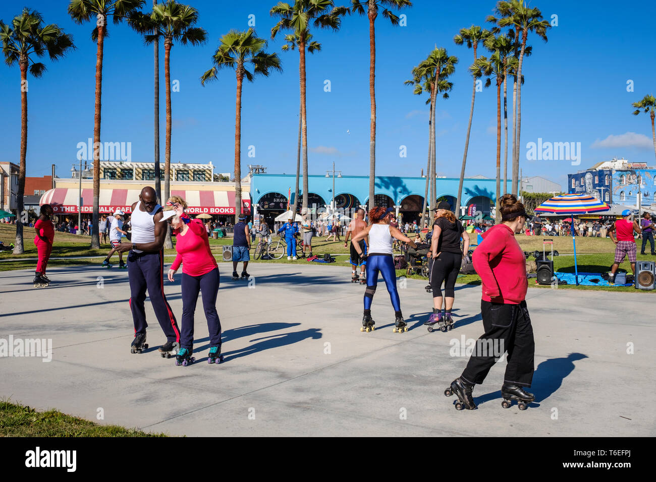 Roller skate dancers enjoying a great sunny day in Venice Beach, Los