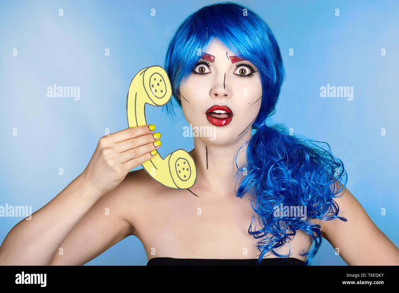 Portrait of young woman in comic pop art make-up style. Female in blue wig  on blue background calls by phone Stock Photo - Alamy