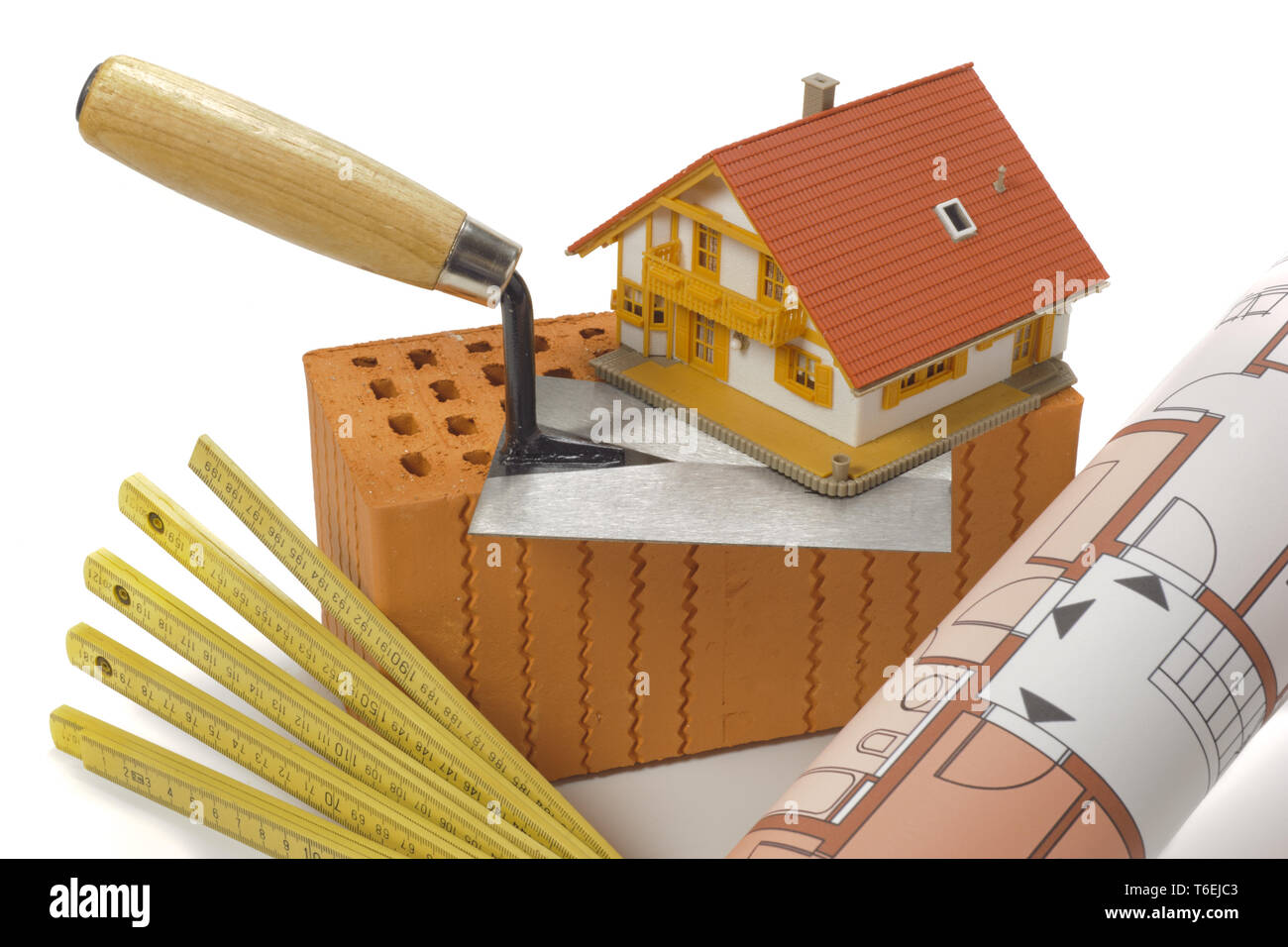 brick for house construction and tools isolated over white background Stock Photo