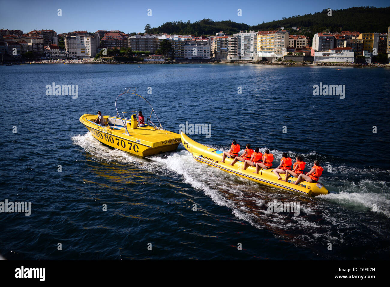 Inflatable towable banana tube in Sanxenxo, Pontevedra, Galicia, Spain Stock Photo