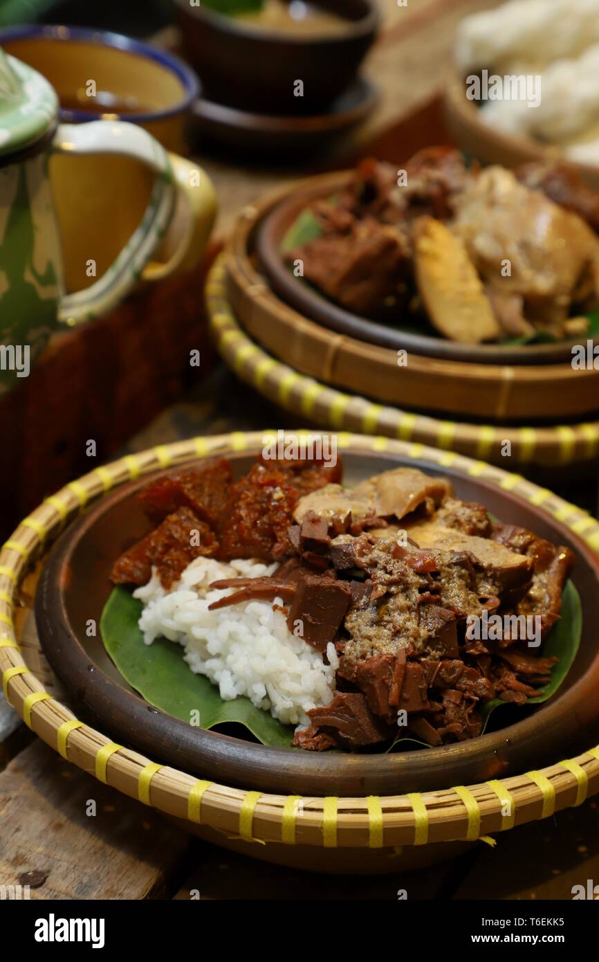 Nasi Gudeg. Traditional Javanese meal of steamed rice with jackfruit stew, chicken curry, and cattle skin cracker stew. Stock Photo