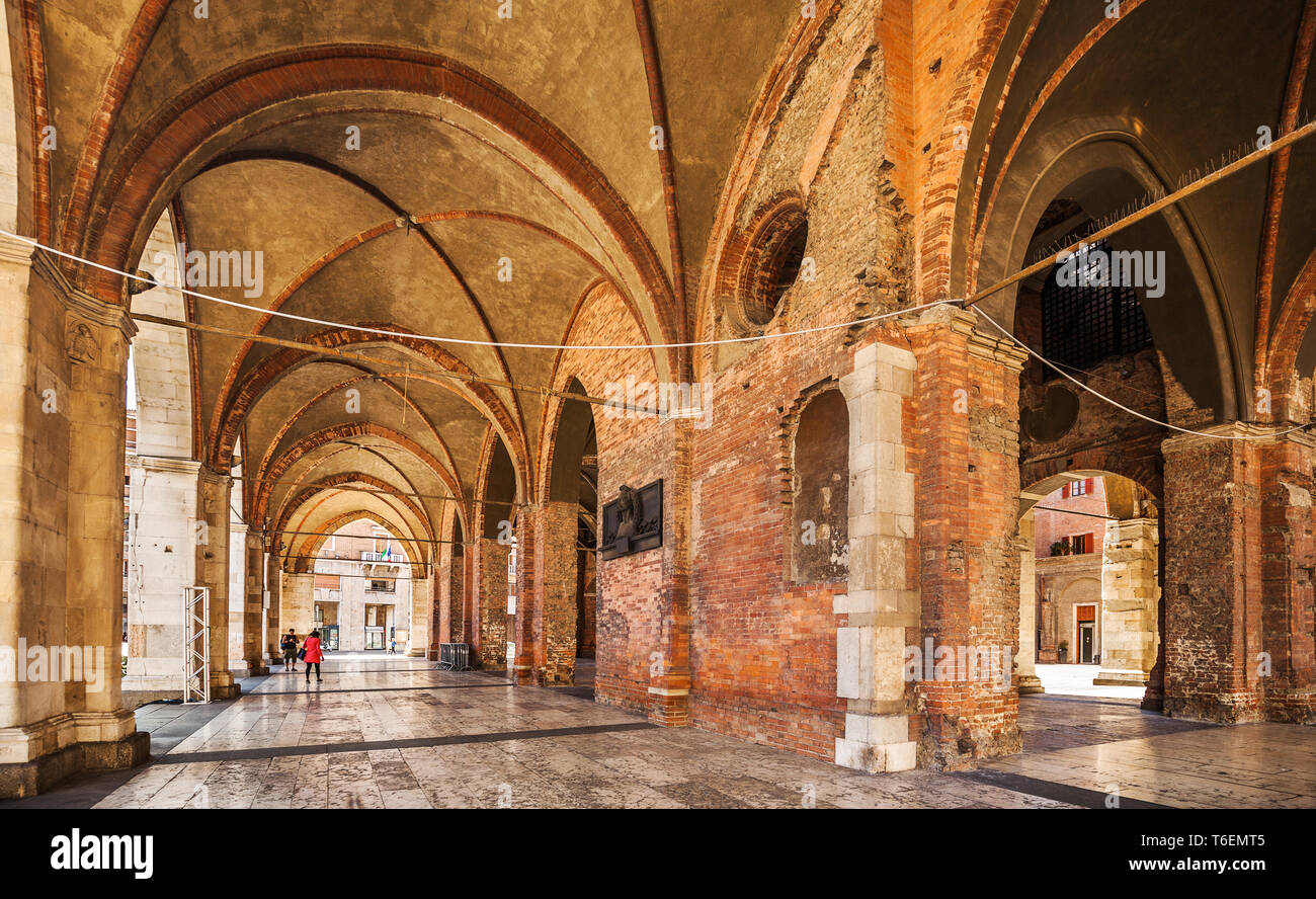 Arcades of the Gothic palace in the center of Piacenza Stock Photo