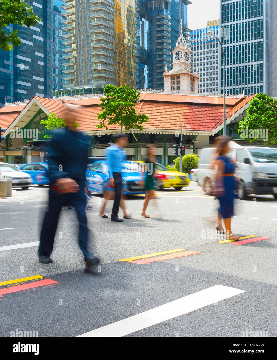 Motioned people crossing road Singapore Stock Photo - Alamy