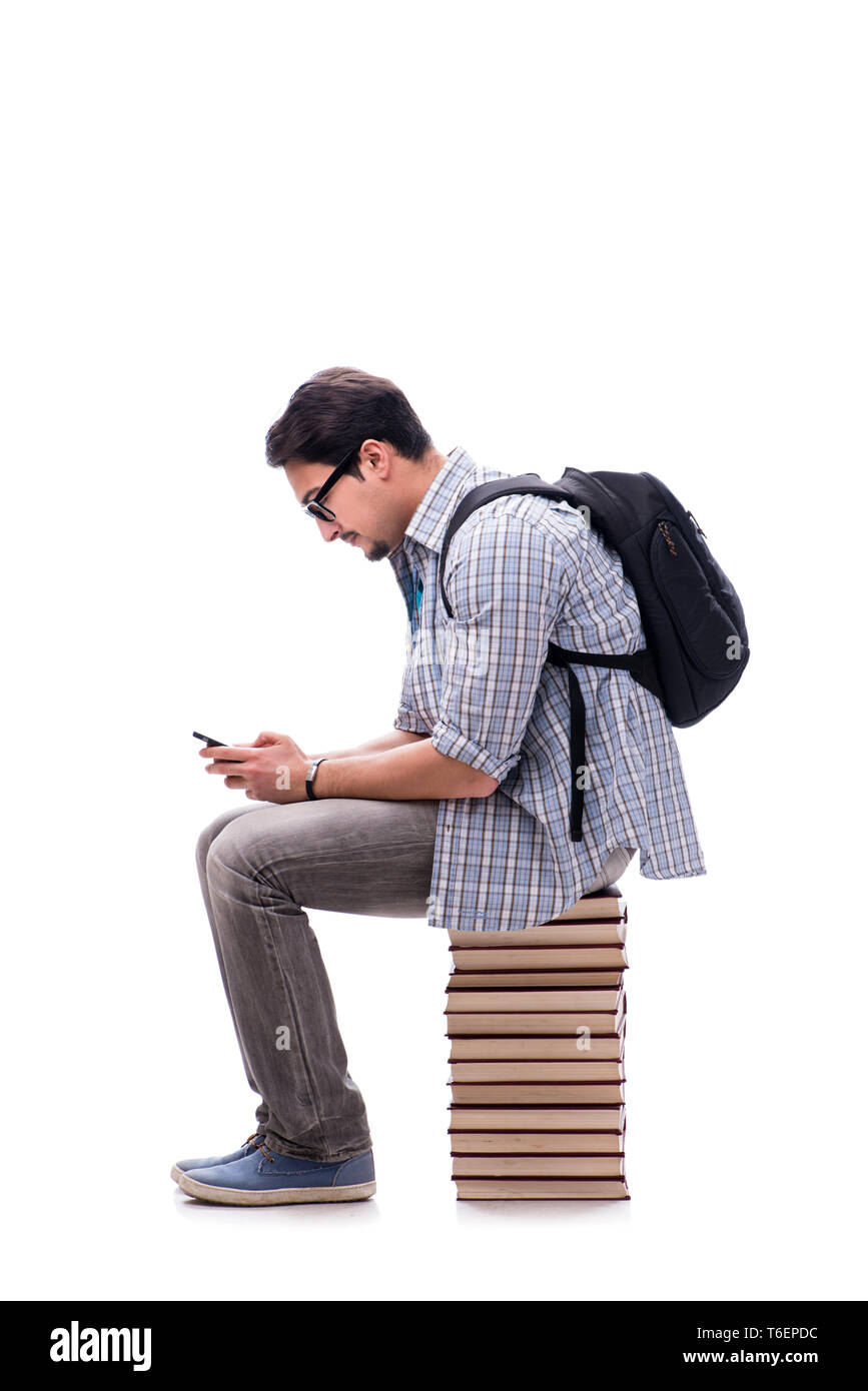 Young student sitting on top of book stack on white Stock Photo - Alamy