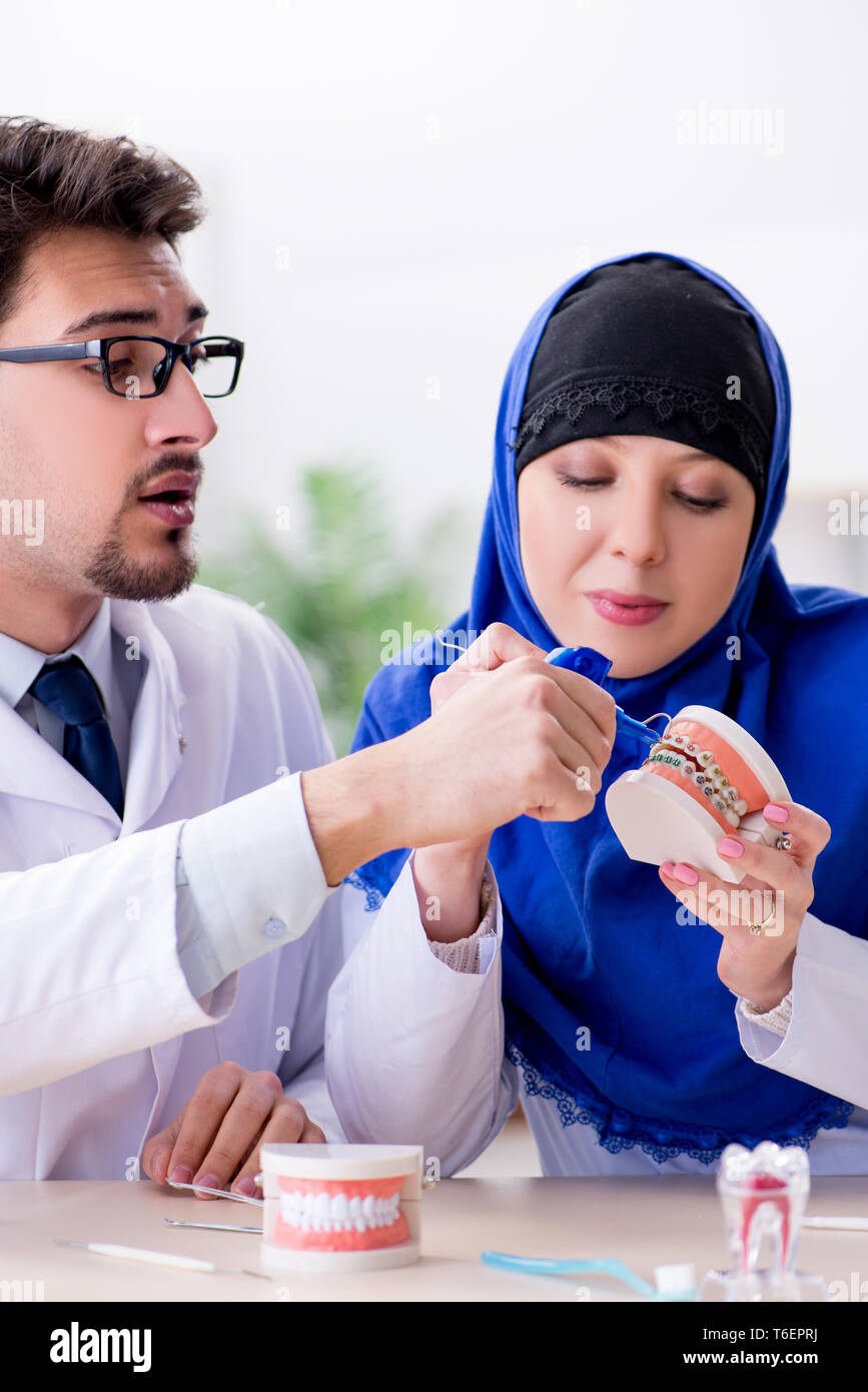Dentist doctor and assistant working on new tooth implant Stock Photo Alamy