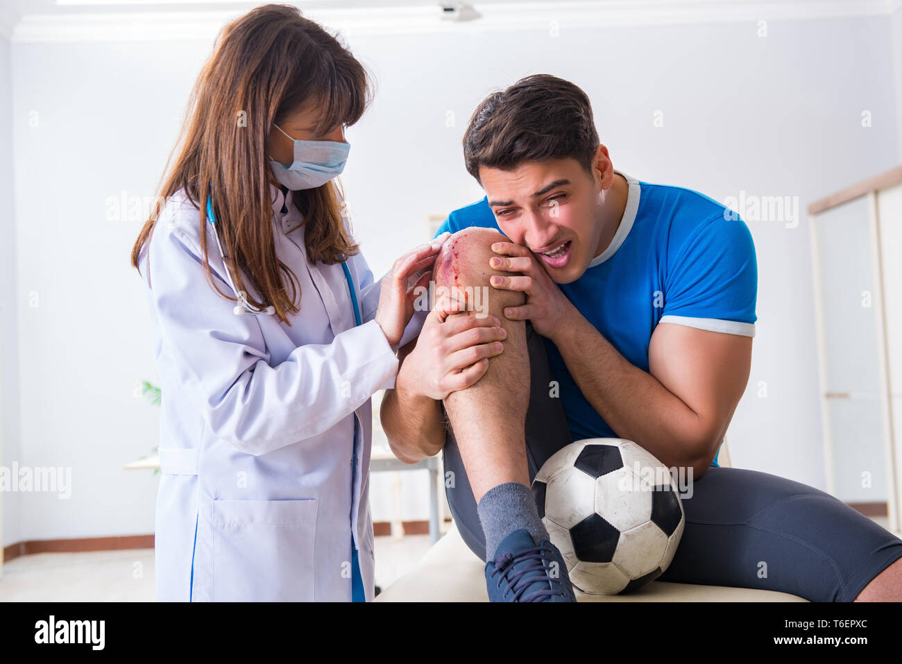 Football Soccer Player Visiting Doctor After Injury Stock Photo - Alamy