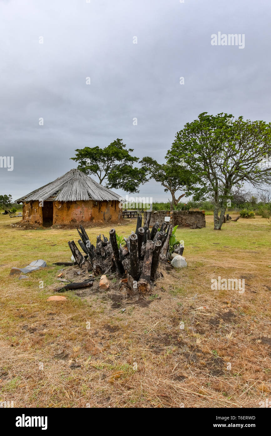 Hut House in the background with dry burnt bark Stock Photo
