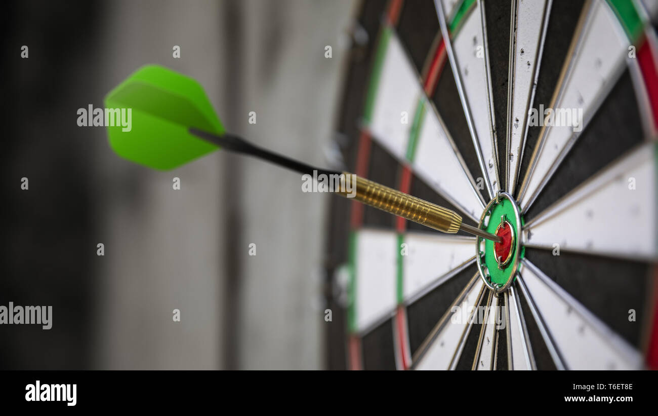 a typical darts game with dart in the bullseye Stock Photo Alamy