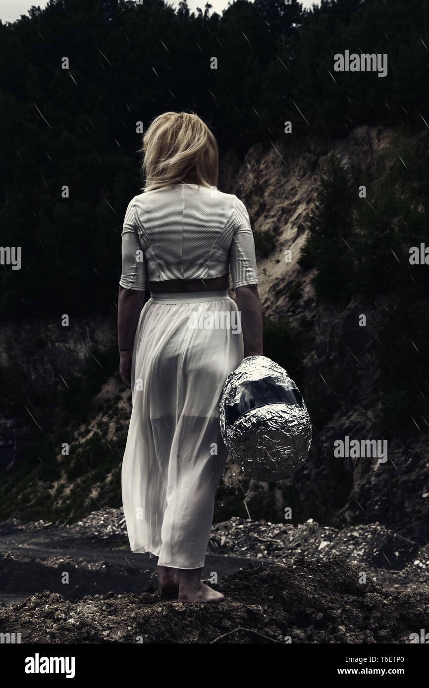 Woman standing on the rocks hi-res stock photography and images - Alamy