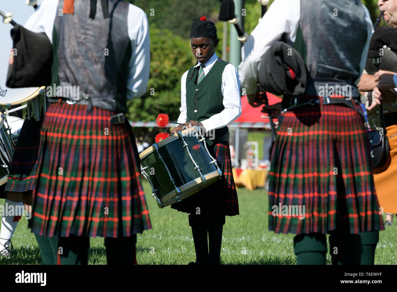 Young man playing drum in pipe band, annual Highland Gathering, 2019, Amanzimtoti, KwaZulu-Natal, South Africa, people, bagpipes, kilts, standing Stock Photo