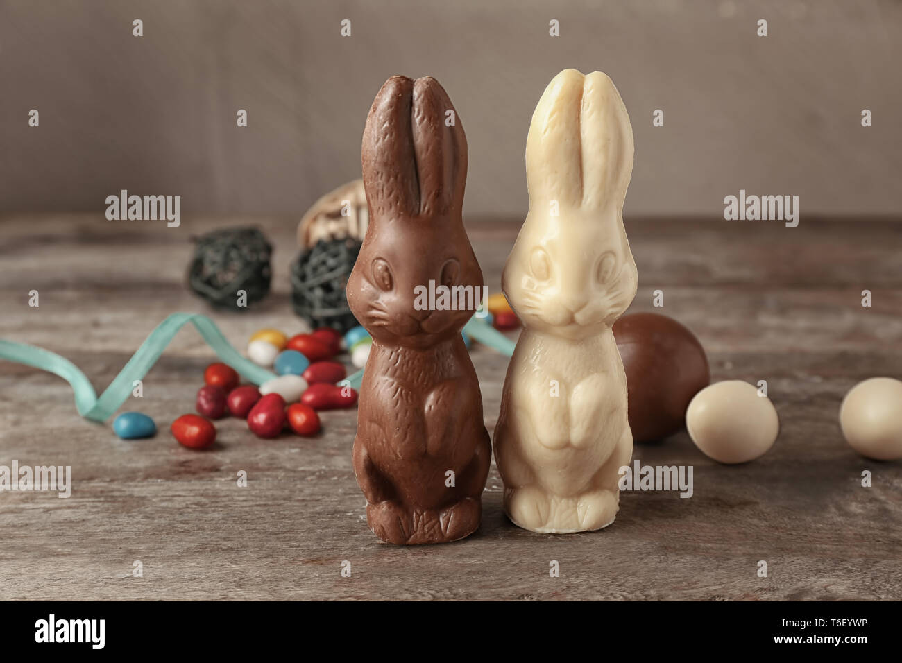 Chocolate Easter bunnies on wooden table Stock Photo