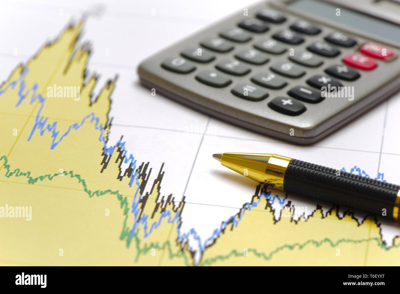 calculator and pencil laying on financial business chart Stock Photo