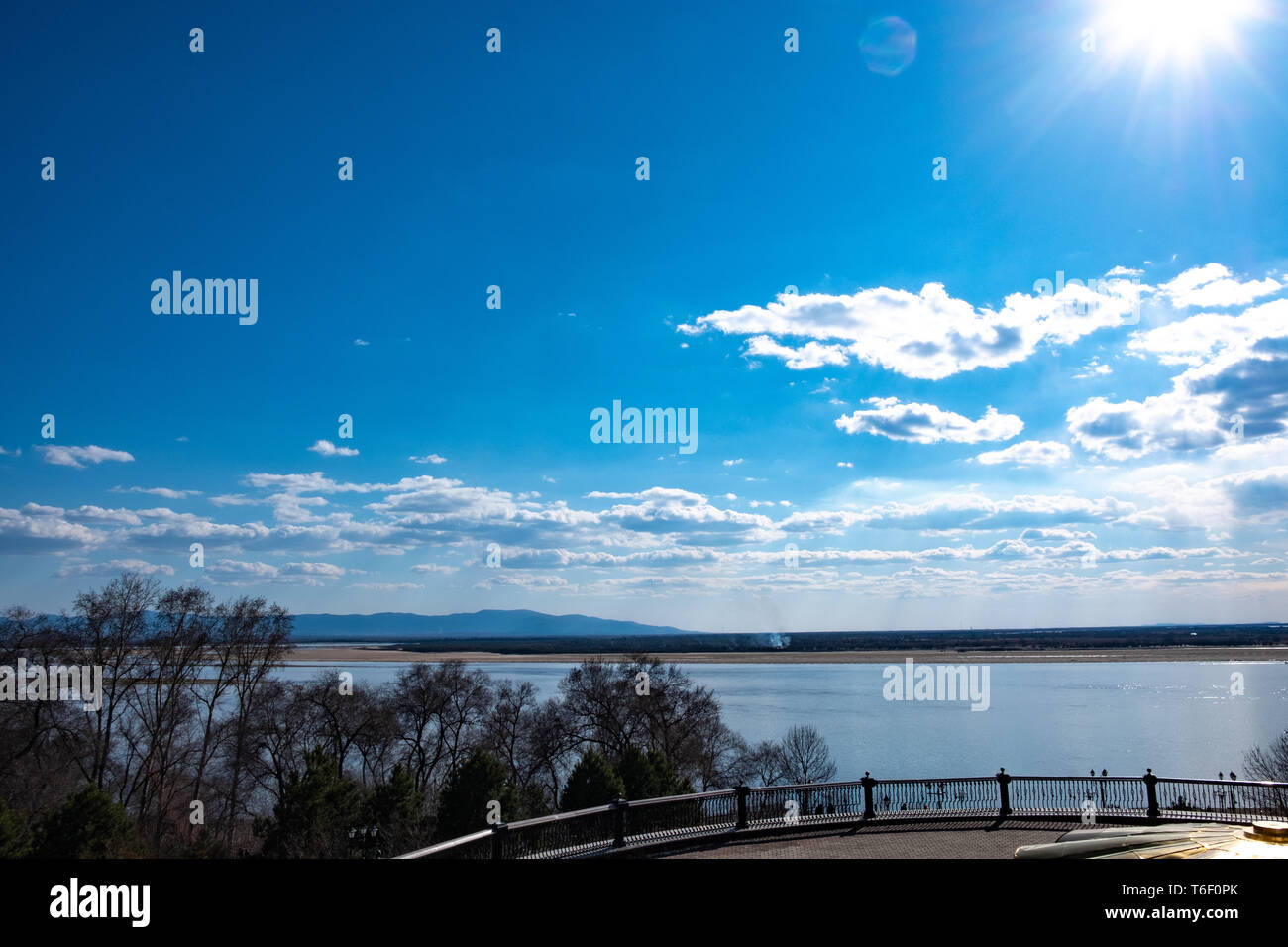 The spring Park is illuminated by the bright sun. View of a large and ...