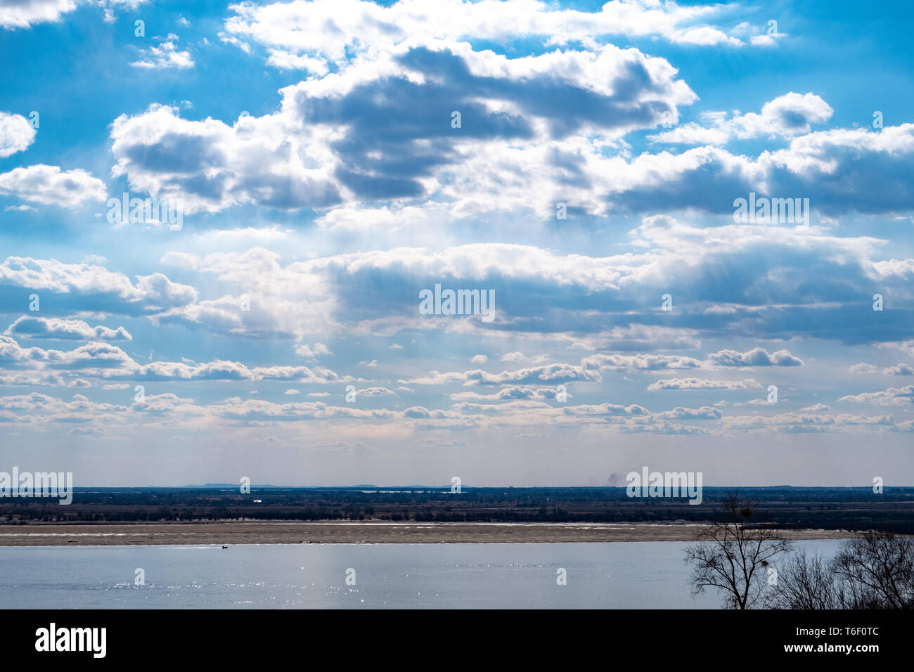 The spring Park is illuminated by the bright sun. View of a large and ...