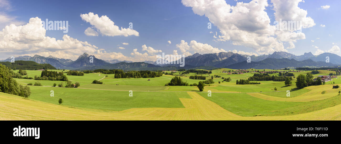 Panoramic landscape in Bavaria with alps mountain range at spring Stock Photo
