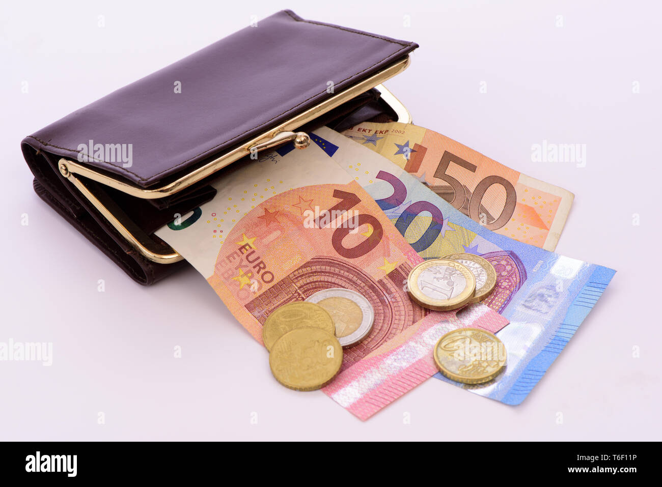 Purse with coins and banknotes of European currency Stock Photo
