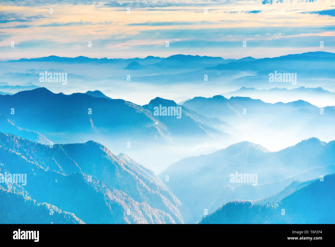Landscape with sunset in blue mountains Stock Photo