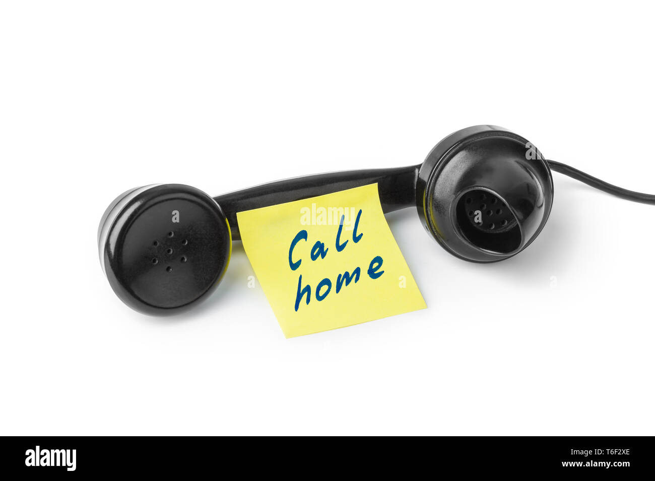Vintage telephone and paper Call home Stock Photo