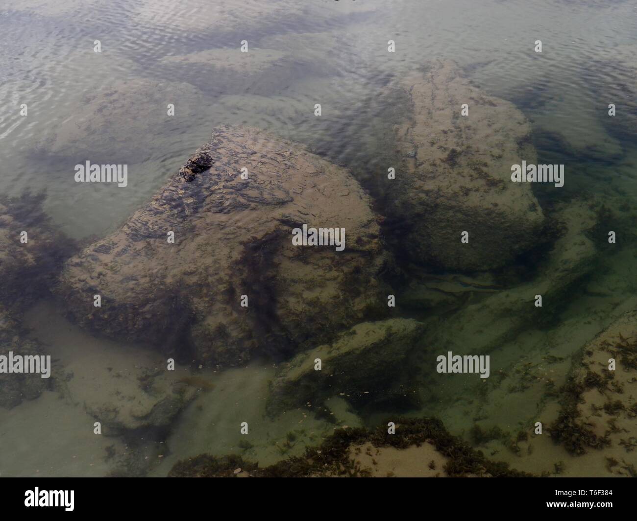 Mellow Racks Beach Sand ripples patterns rocks beach water hi-res stock photography and ...