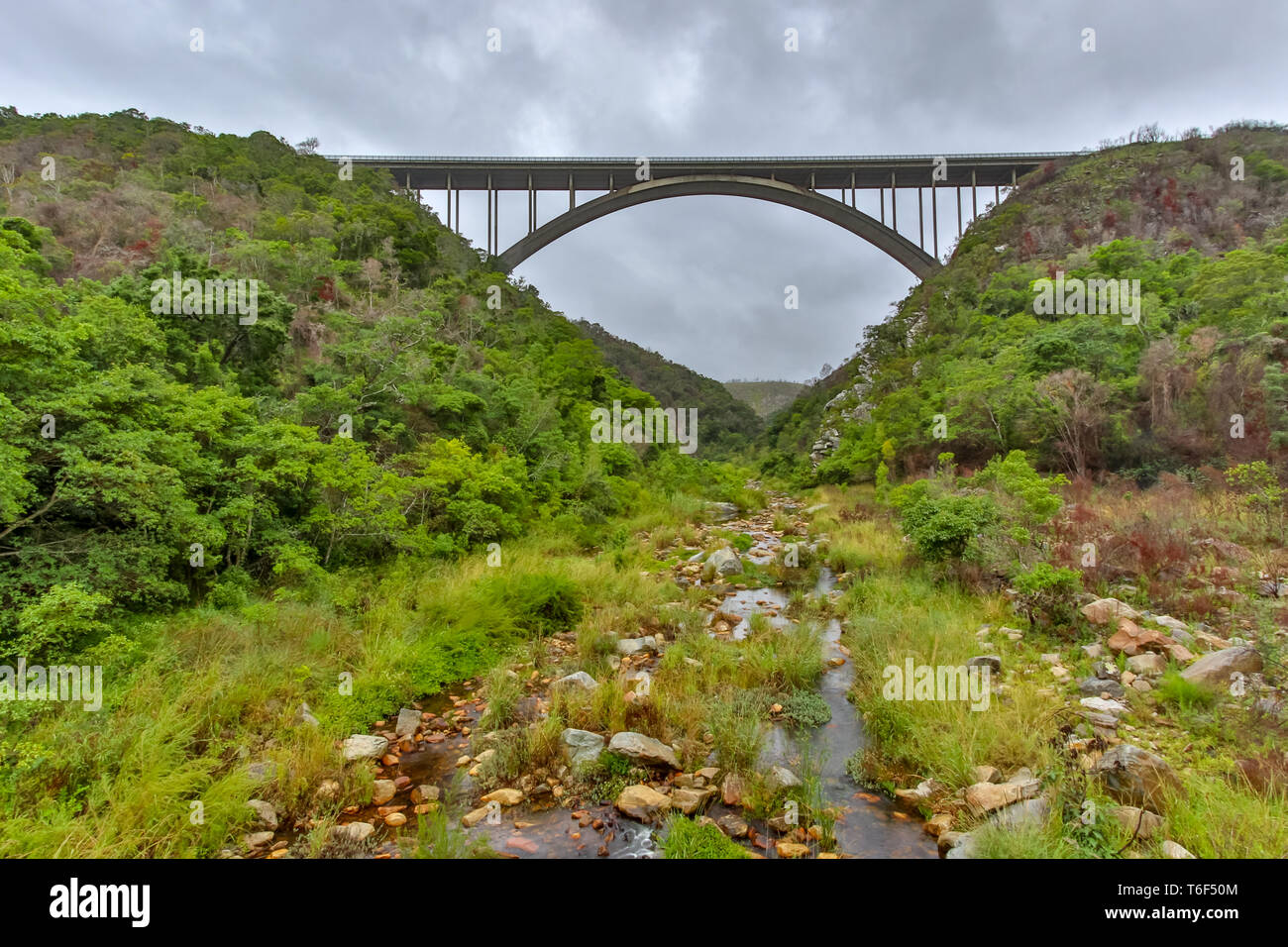 Bridge with the river flowing below Stock Photo
