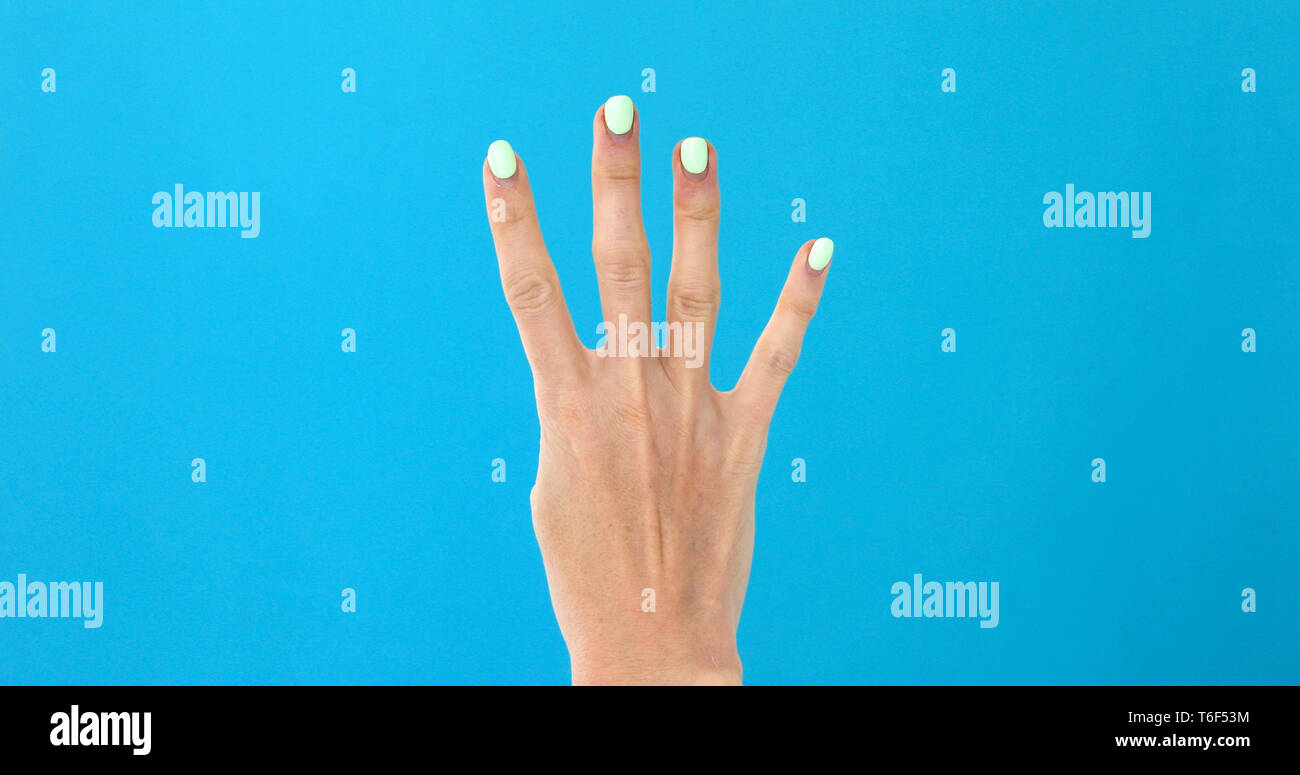 Closeup female hand counting from 4 Stock Photo