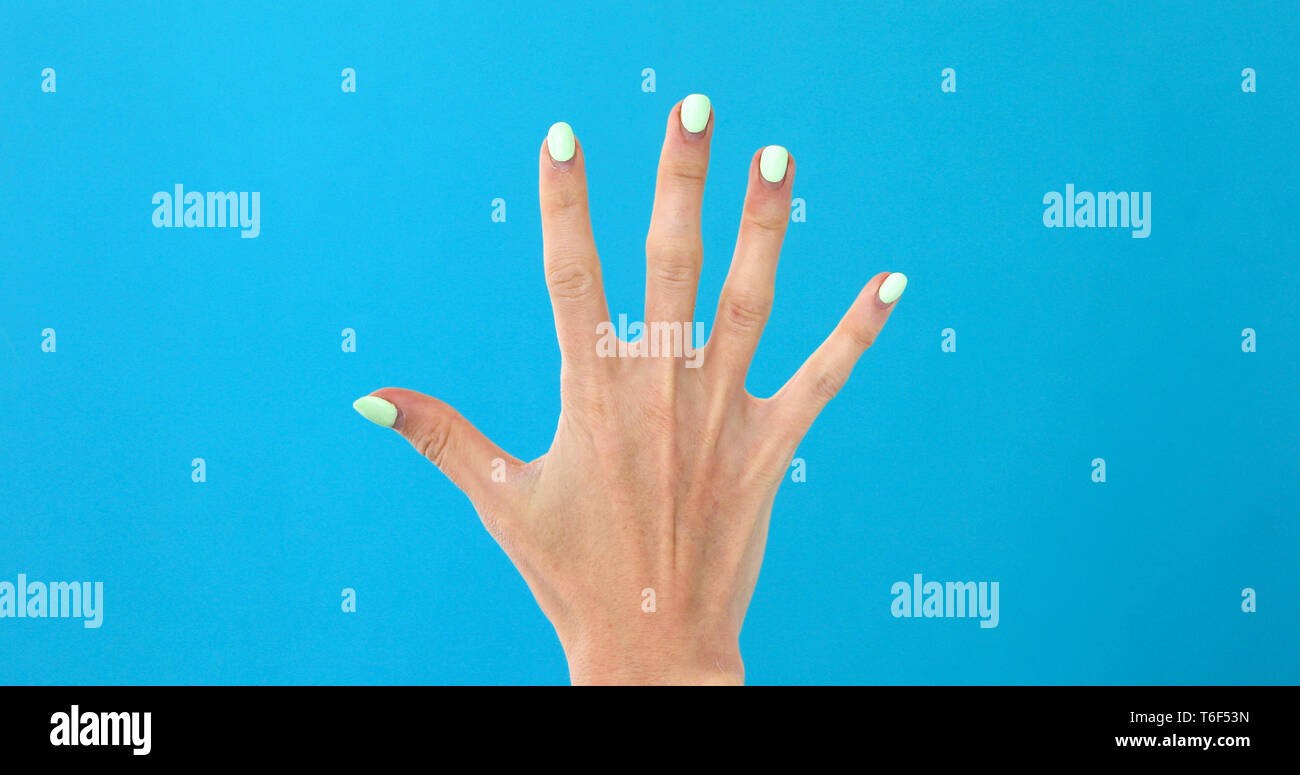 Closeup female hand counting to 5 Stock Photo