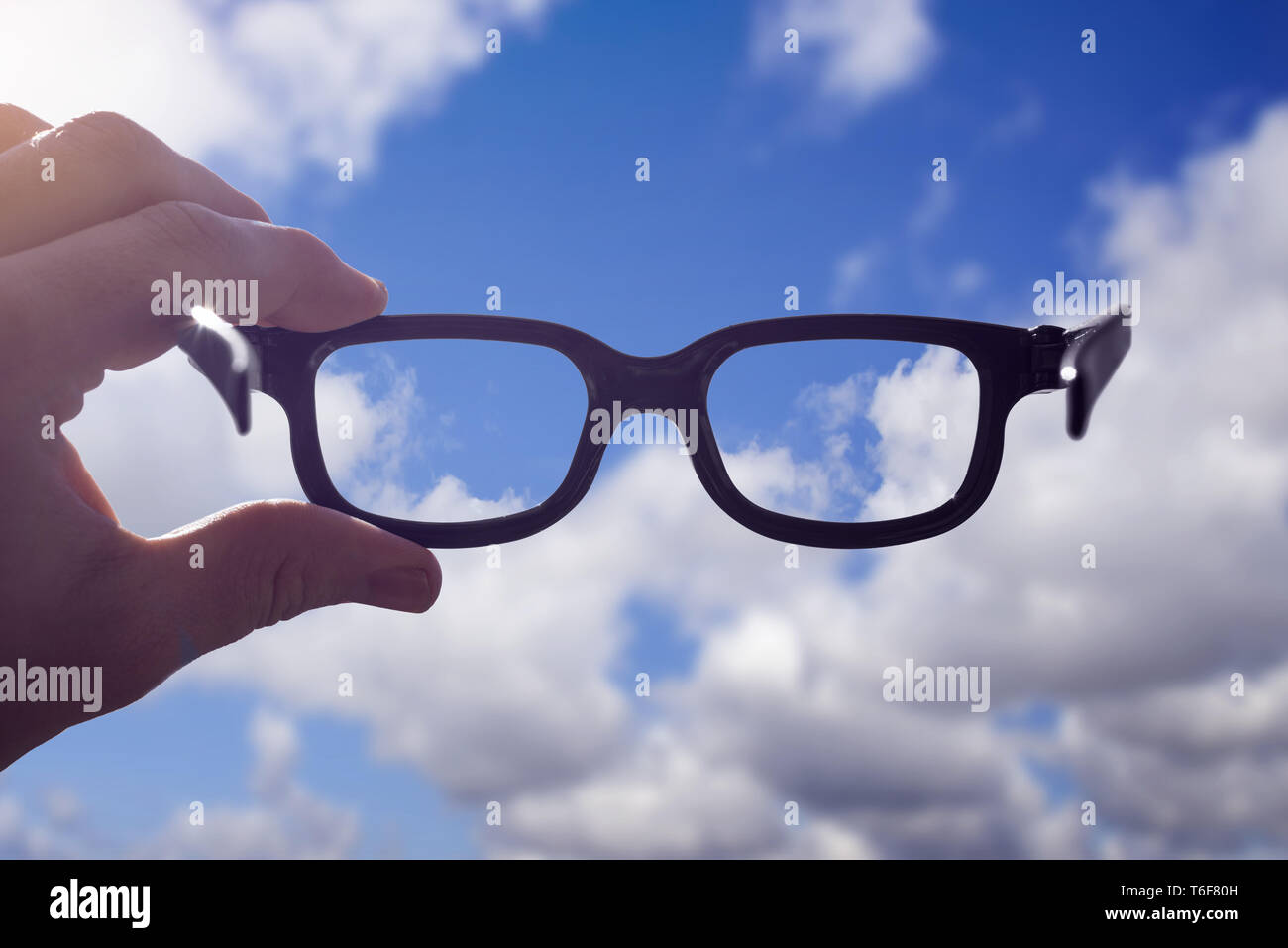 Hand glasses sky Stock Photo