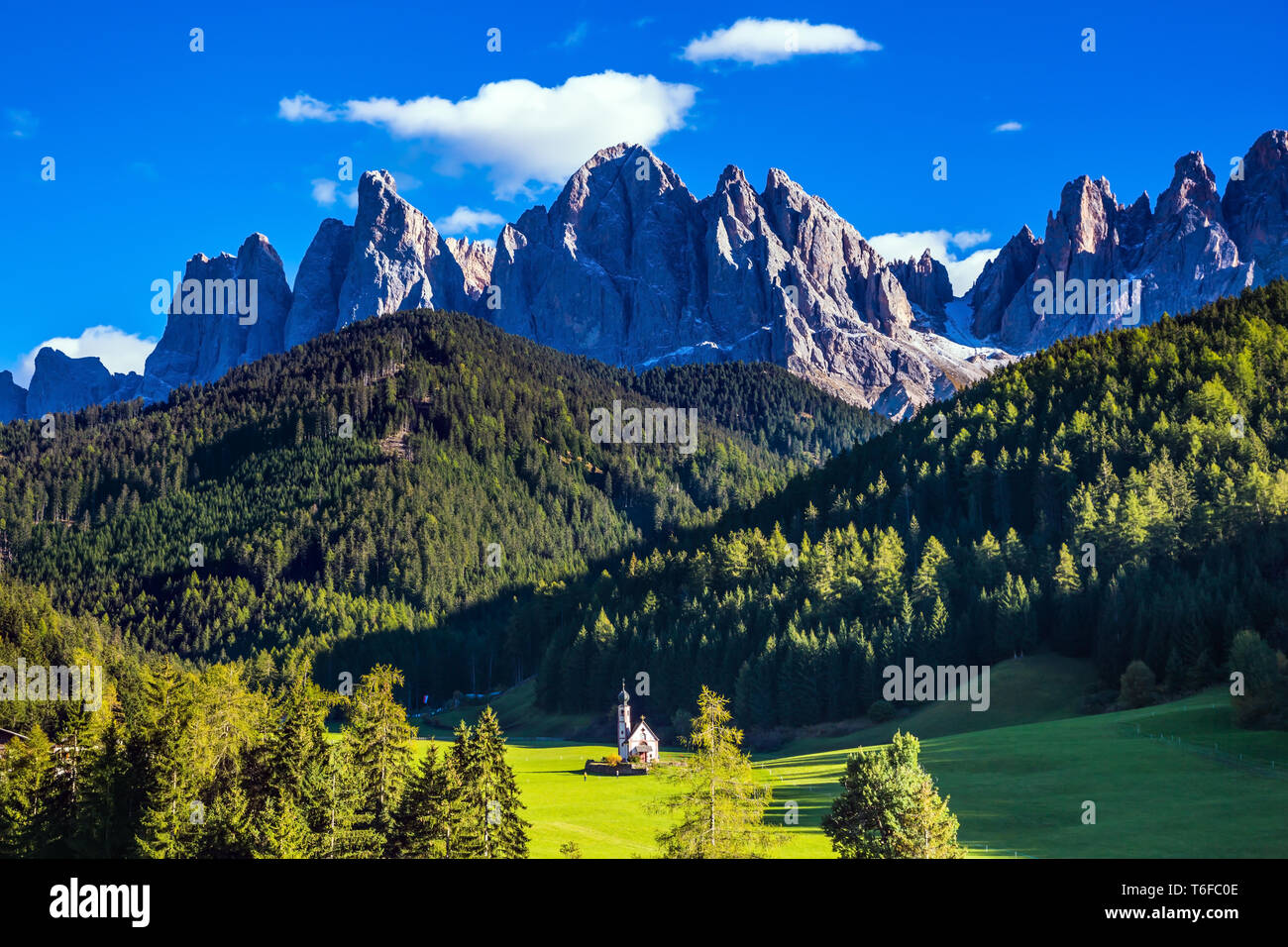 Rocky peaks and forested mountains Stock Photo