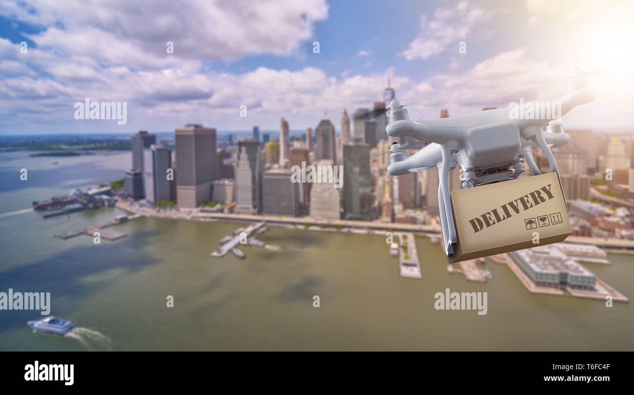 Drone flying with package over lower Manhatten, New York City Stock Photo