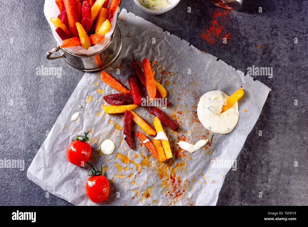 vegetable French fries with herb quark and tomatoes Stock Photo Alamy