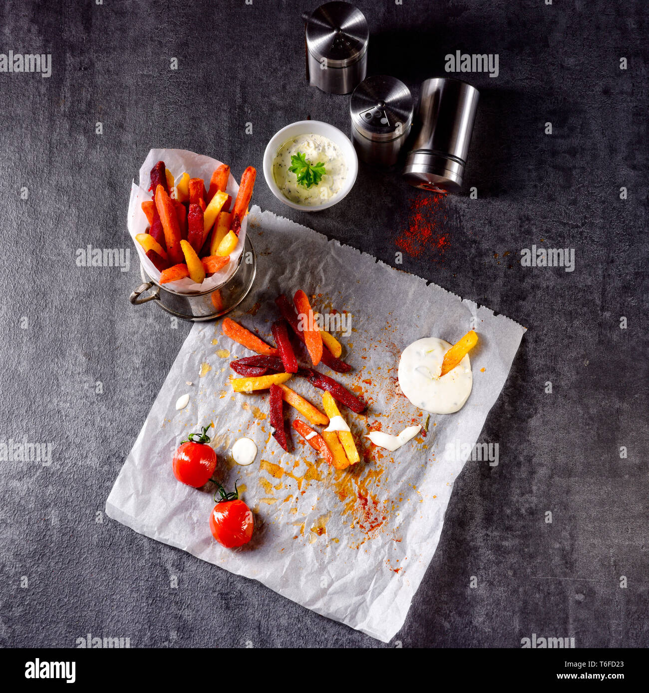 vegetable French fries with herb quark and tomatoes Stock Photo Alamy