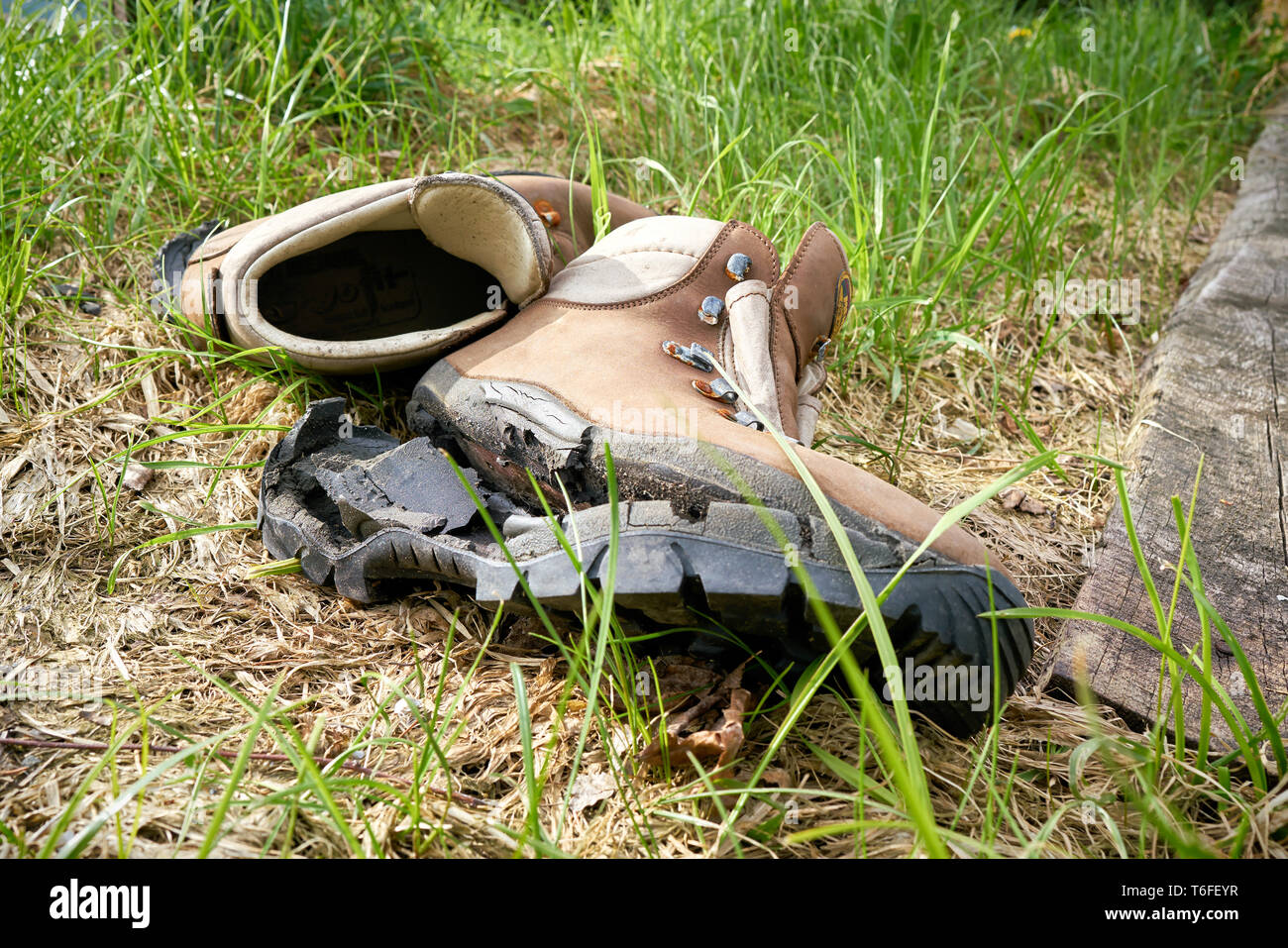 broken hiking boots on a hiking trail Stock Photo Alamy